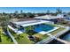 House with a pool and dock on the water at 8 Island Dr, Treasure Island, FL 33706
