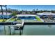 Aerial view of waterfront home with private dock and pool at 8 Island Dr, Treasure Island, FL 33706