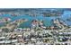 Aerial view of property location on a canal with neighboring houses and waterway at 8 Island Dr, Treasure Island, FL 33706