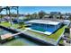 House with a pool and dock on the water at 8 Island Dr, Treasure Island, FL 33706