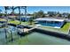 Waterfront property boasts a private pool, dock, and amazing canal views at 8 Island Dr, Treasure Island, FL 33706