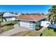 House with a well-maintained lawn and dock at 8 Island Dr, Treasure Island, FL 33706