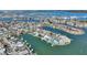 Wide aerial showcasing home's waterfront location and proximity to the beach at 8 Island Dr, Treasure Island, FL 33706