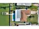 Bird's-eye view of the house, pool, dock, and backyard at 8 Island Dr, Treasure Island, FL 33706