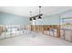 Dining room under renovation, showing new light fixture and exposed framing at 8 Island Dr, Treasure Island, FL 33706
