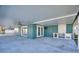 Spacious covered patio with outdoor kitchen and ceiling fan, perfect for entertaining at 8 Island Dr, Treasure Island, FL 33706