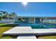 Inviting pool and patio area, perfect for outdoor entertaining at 8 Island Dr, Treasure Island, FL 33706