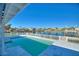 Serene poolside view showcasing a picturesque waterfront scene at 8 Island Dr, Treasure Island, FL 33706