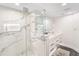 Modern bathroom with a large marble shower, double vanity, and sleek design at 888 Boulevard Of The Arts # 1705, Sarasota, FL 34236