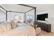 Spacious main bedroom with a large bed, plenty of light and bay views at 888 Boulevard Of The Arts # 1705, Sarasota, FL 34236
