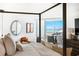 Main bedroom with king-size bed and stunning water views at 888 Boulevard Of The Arts # 1705, Sarasota, FL 34236