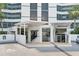 Modern building exterior with covered entryway and accessible parking at 888 Boulevard Of The Arts # 1705, Sarasota, FL 34236