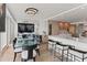 Modern dining area with glass table and kitchen views at 888 Boulevard Of The Arts # 1705, Sarasota, FL 34236