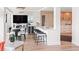 Modern dining area with glass table and kitchen views at 888 Boulevard Of The Arts # 1705, Sarasota, FL 34236