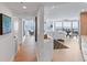 Modern entryway with hardwood floors, open floor plan, and water views at 888 Boulevard Of The Arts # 1705, Sarasota, FL 34236