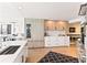 Modern kitchen with light wood and white cabinets and marble countertops at 888 Boulevard Of The Arts # 1705, Sarasota, FL 34236