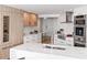 Modern kitchen with stainless steel appliances and marble countertops at 888 Boulevard Of The Arts # 1705, Sarasota, FL 34236