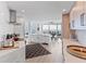 Modern kitchen with white cabinetry, marble countertops, and stainless steel appliances at 888 Boulevard Of The Arts # 1705, Sarasota, FL 34236