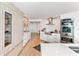Modern kitchen with light wood cabinets, marble countertops, and high-end appliances at 888 Boulevard Of The Arts # 1705, Sarasota, FL 34236