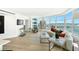 Living room with curved sofa and stunning bay views at 888 Boulevard Of The Arts # 1705, Sarasota, FL 34236