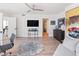 Home office with hardwood floors, large windows and a comfortable couch at 888 Boulevard Of The Arts # 1705, Sarasota, FL 34236