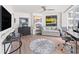 Home office with hardwood floors, large windows and a comfortable couch at 888 Boulevard Of The Arts # 1705, Sarasota, FL 34236