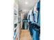 Large walk-in closet with ample shelving and hanging space for clothes at 888 Boulevard Of The Arts # 1705, Sarasota, FL 34236