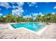 Sparkling community pool with ample deck space for sunbathing at 8911 Manor Loop # 102, Lakewood Ranch, FL 34202