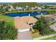 Aerial view of a single-Gathering home with a lake view in a residential community at 9007 Brookfield Ter, Bradenton, FL 34212