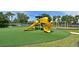 Community playground with slides, playset, and turf at 9007 Brookfield Ter, Bradenton, FL 34212