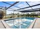 Screened-in pool provides a refreshing escape at 1018 Deer Run, Venice, FL 34293