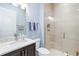 Stylish bathroom with a quartz countertop and a walk-in shower at 10924 Bullrush Dr, Venice, FL 34293