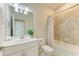 Clean bathroom with a bathtub, shower, white vanity, and updated fixtures at 11200 Balfour St, Venice, FL 34293