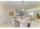 Modern kitchen island with granite countertop and stainless steel appliances at 11200 Balfour St, Venice, FL 34293