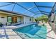 Inviting screened-in pool and spa with plenty of patio space at 11200 Balfour St, Venice, FL 34293