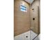 Modern shower with textured wall tiles and glass enclosure at 1173 Rotonda Cir, Rotonda West, FL 33947