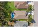 Aerial view showcasing home, pool, and surrounding neighborhood at 11822 Forest Park Cir, Bradenton, FL 34211