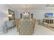 Elegant dining room featuring a rustic table and statement chandelier at 13109 Palermo Dr, Bradenton, FL 34211