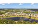 Aerial view of a residential neighborhood showing lakefront properties and landscaping at 1330 Still River Dr, Venice, FL 34293