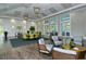 Bright, elegant lounge with comfortable seating, stylish decor, and access to outdoor views at 1330 Still River Dr, Venice, FL 34293