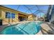 Lush pool area with screened enclosure and patio at 1330 Still River Dr, Venice, FL 34293