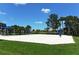 Enjoy a friendly game of volleyball on the community sand court perfect for outdoor recreation at 1330 Still River Dr, Venice, FL 34293