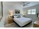 This bedroom features a bright, airy feel with a ceiling fan and a large window at 157 Garden Ln, Sarasota, FL 34242
