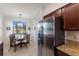 Kitchen features stainless steel refrigerator and granite countertops at 16814 Vardon Ter # 208, Bradenton, FL 34211