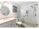 Updated bathroom with white subway tiles, a walk-in shower, and a built-in bench at 2109 67Th Street E Ct, Bradenton, FL 34208