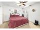 Main bedroom with a comfortable bed and en-suite bathroom access at 2109 67Th Street E Ct, Bradenton, FL 34208