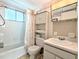 Clean bathroom with shower/tub combo, vanity, and storage at 2228 Canal Dr # D26, Bradenton, FL 34207