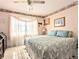 Main bedroom with king-size bed and ample natural light at 2228 Canal Dr # D26, Bradenton, FL 34207