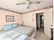 Bedroom with king-size bed and access to the bathroom at 2228 Canal Dr # D26, Bradenton, FL 34207