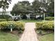 Brick paved courtyard with picnic tables and landscaping at 2228 Canal Dr # D26, Bradenton, FL 34207